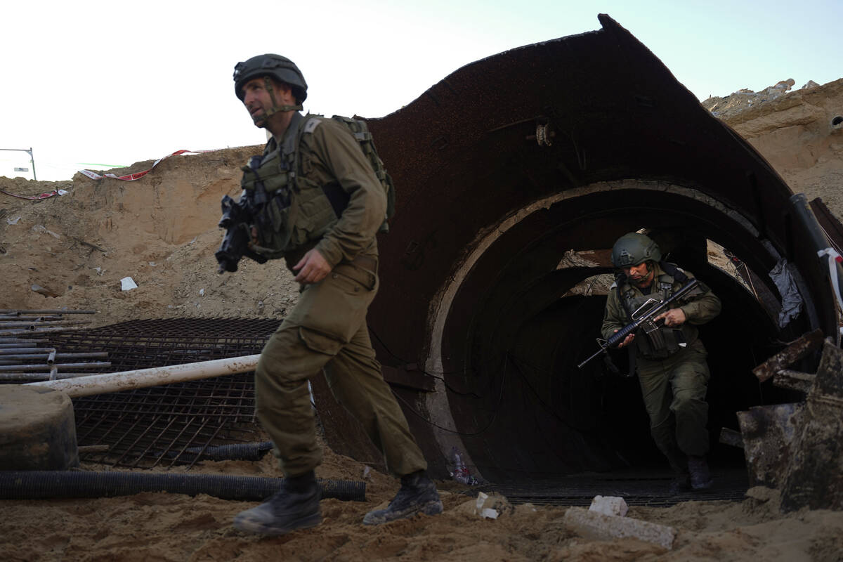 Israeli soldiers exit a tunnel that the military says Hamas militants used to attack the Erez c ...