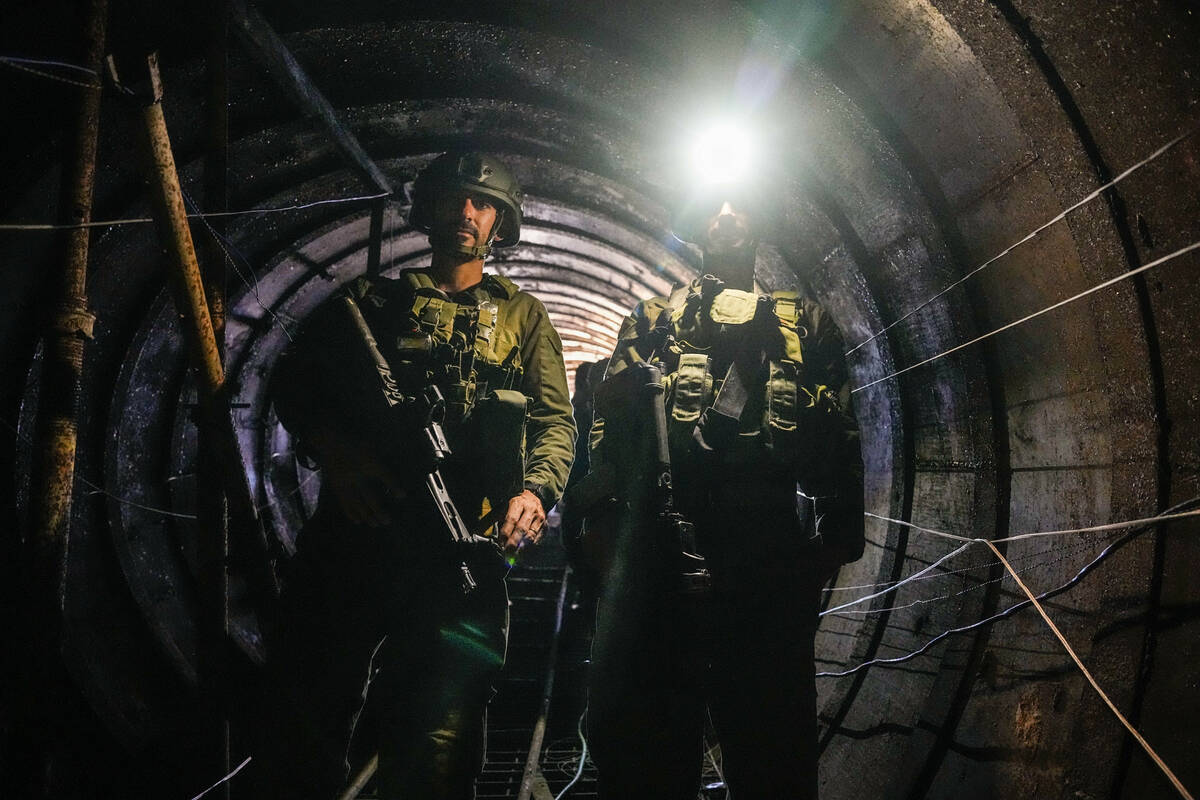 Israeli soldiers are seen in a tunnel that the military says Hamas militants used to attack the ...