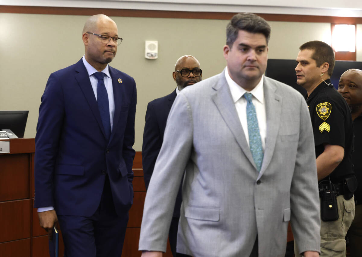 Nevada's Attorney General Aaron Ford, left, and Matthew Rashbrook, a special prosecutor, enter ...