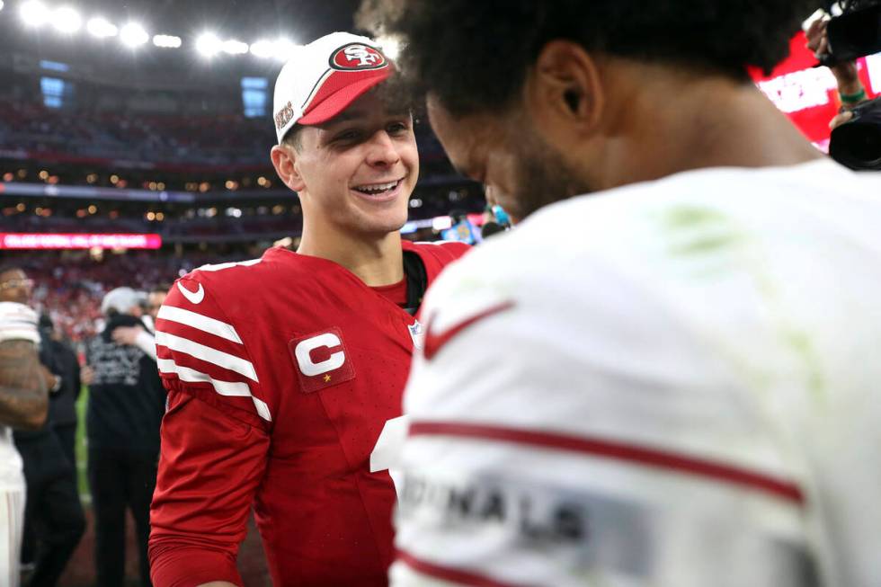 San Francisco 49ers' Brock Purdy, left, greets Arizona Cardinals' Kyler Murray, right, after th ...