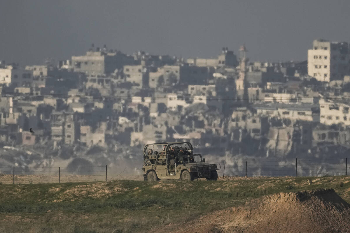 Israeli soldiers are seen along the Israeli-Gaza border, southern Israel, Tuesday, Dec. 19, 202 ...