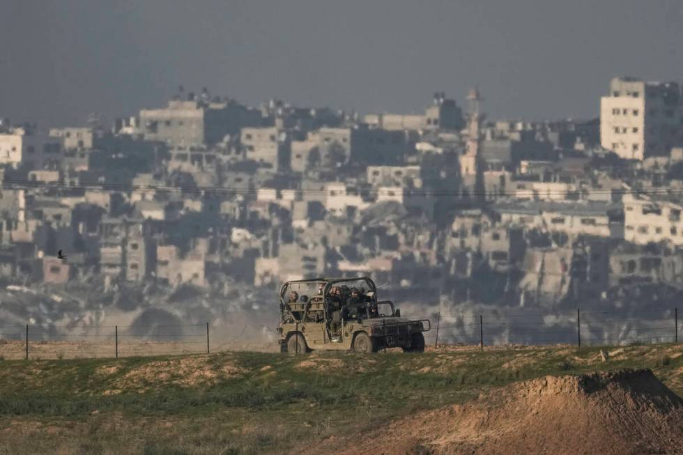 Israeli soldiers are seen along the Israeli-Gaza border, southern Israel, Tuesday, Dec. 19, 202 ...