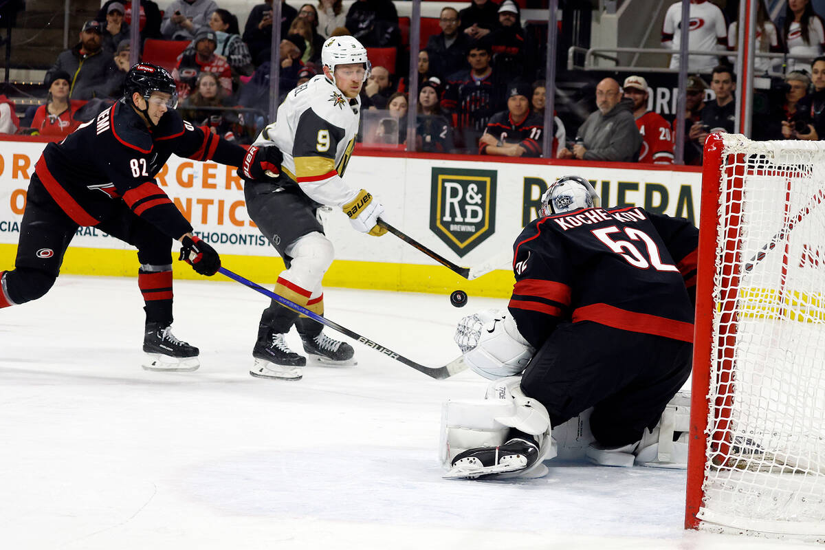 Vegas Golden Knights' Jack Eichel (9) shoots the puck toward Carolina Hurricanes goaltender Pyo ...