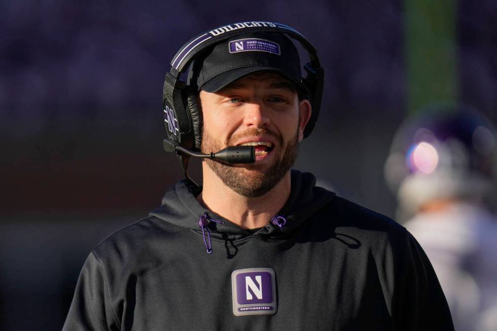 Northwestern head coach David Braun walks the sideline during the first half of an NCAA college ...