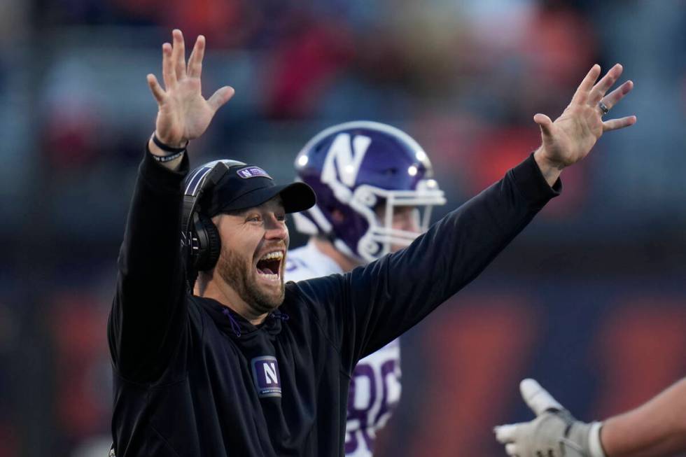 Northwestern head coach David Braun throws up his hands after Illinois offensive lineman Dom D' ...