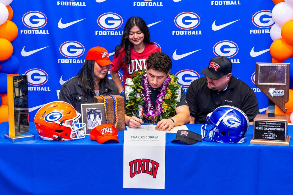 Bishop Gorman player Charles Correa and family with a commitment letter to UNLV during a Nation ...