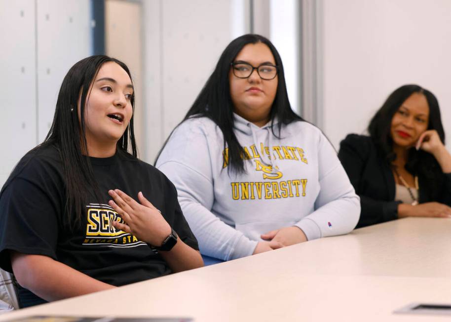 Stephanie Sandoval Aleman, left, a student at Nevada State University, speaks as Mia Calderon, ...