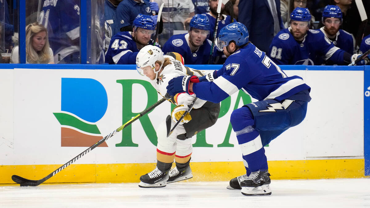 Vegas Golden Knights center William Karlsson (71) gets around Tampa Bay Lightning defenseman Vi ...