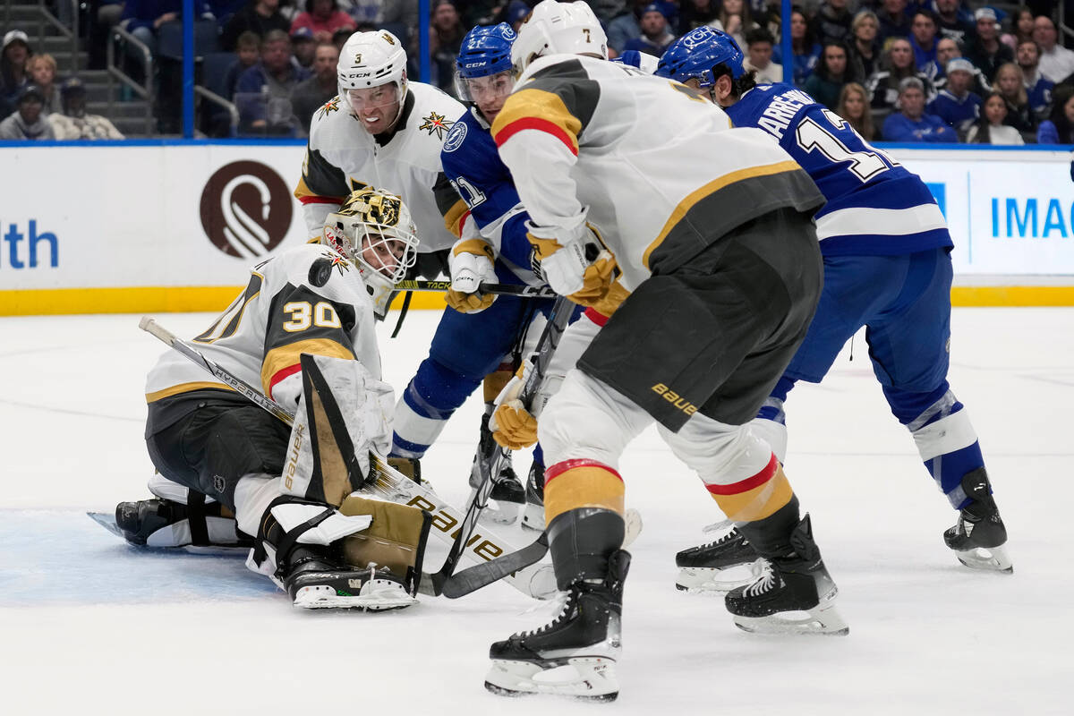 Vegas Golden Knights goaltender Jiri Patera (30) makes a save on a deflection by Tampa Bay Ligh ...