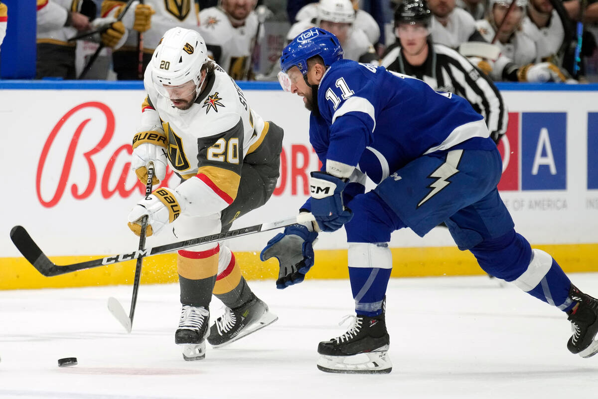 Vegas Golden Knights center Chandler Stephenson (20) and Tampa Bay Lightning center Luke Glende ...