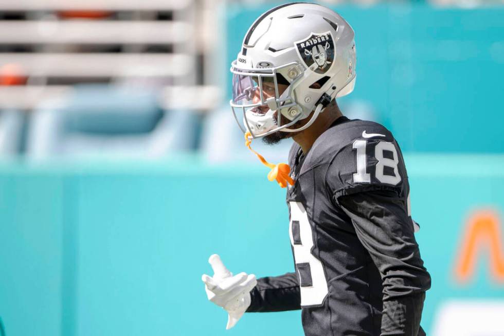 Raiders cornerback Jack Jones (18) warms up before an NFL game against the Miami Dolphins on Su ...