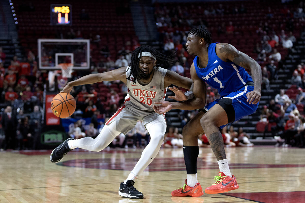 UNLV Rebels forward Keylan Boone (20) drives forward against Hofstra Pride guard Darlinstone Du ...