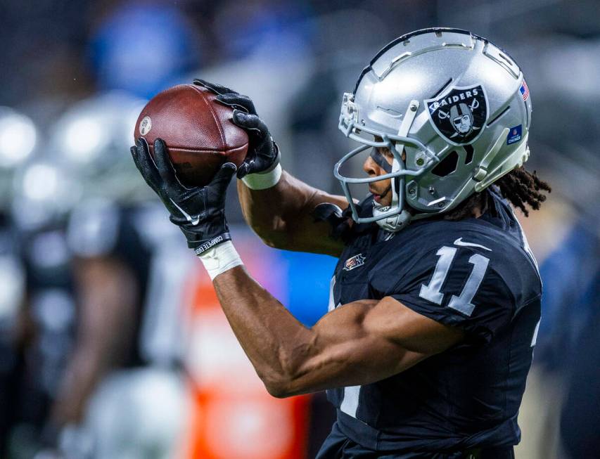 Raiders wide receiver Tre Tucker (11) catches a pass during warmups before the first half of th ...