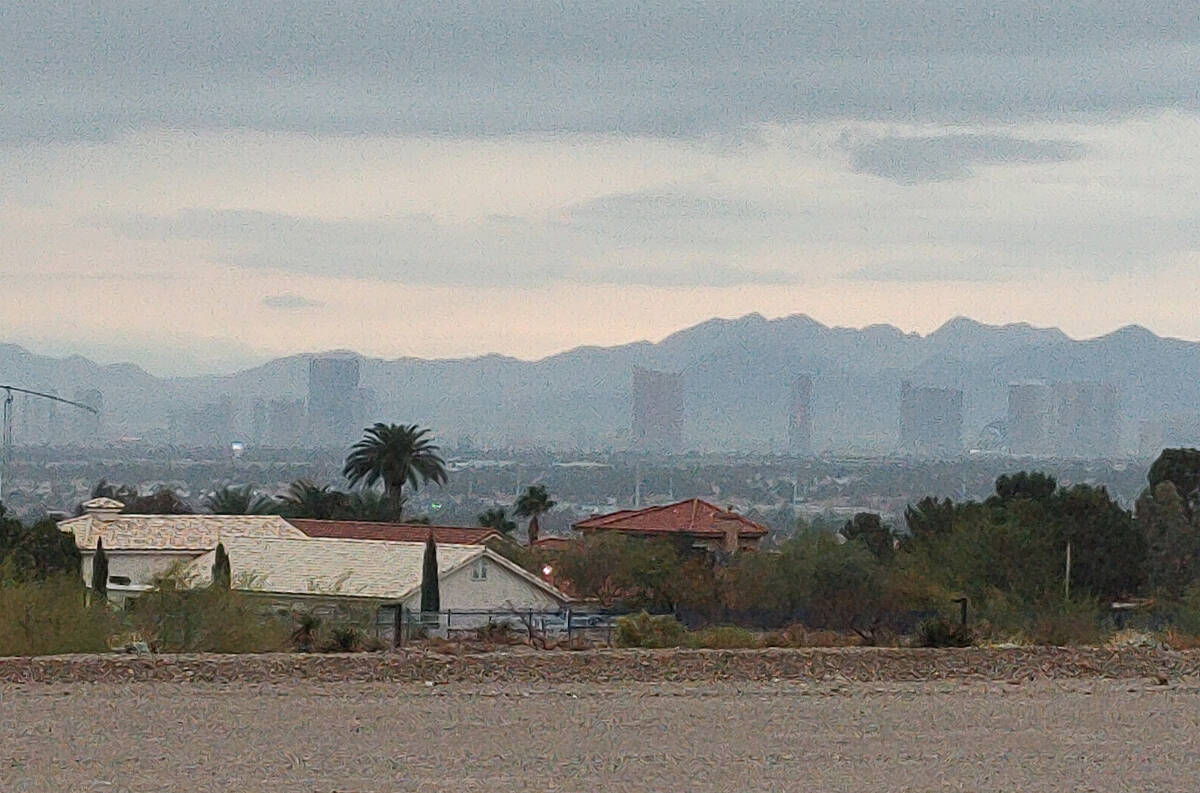 Skies over the Las Vegas Valley begin to clear about 11:30 a.m. Friday, Dec. 22, 2023, as seen ...