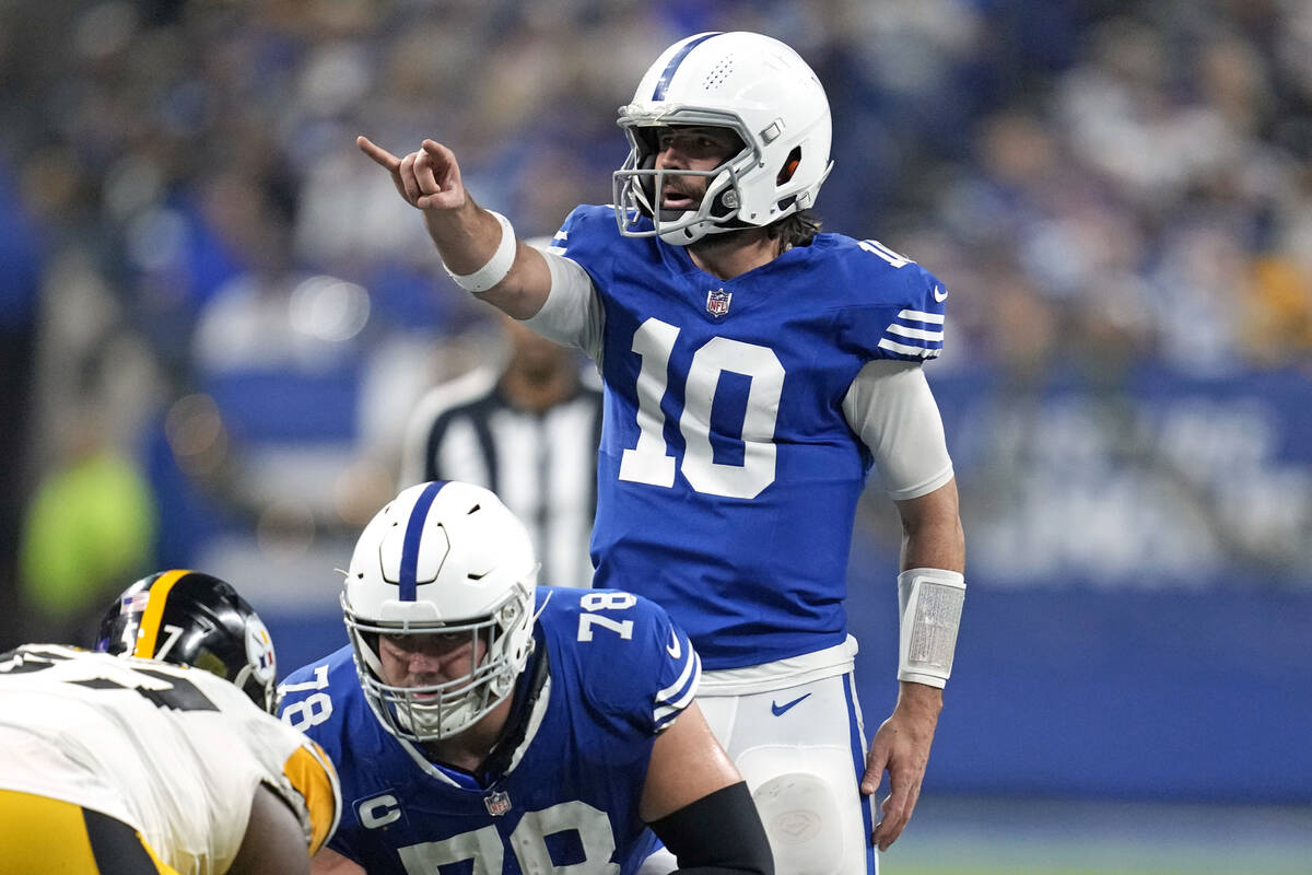 Indianapolis Colts quarterback Gardner Minshew (10) lines up behind center Ryan Kelly (78) duri ...