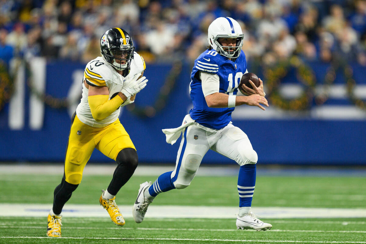 Indianapolis Colts quarterback Gardner Minshew (10) runs away from pressure by Pittsburgh Steel ...