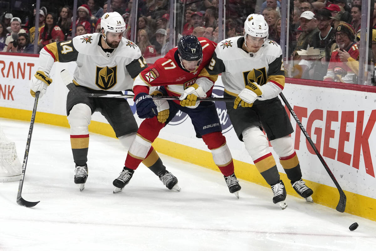 Vegas Golden Knights defenseman Nicolas Hague (14), Florida Panthers center Evan Rodrigues (17) ...