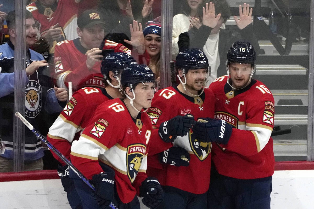 Florida Panthers center Sam Reinhart (13) is congratulated after scoring a goal during the thir ...