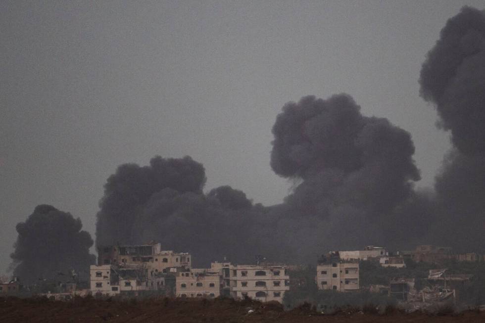 Smoke rises to the sky after an explosion in Gaza Strip as seen from Southern Israel, Saturday, ...