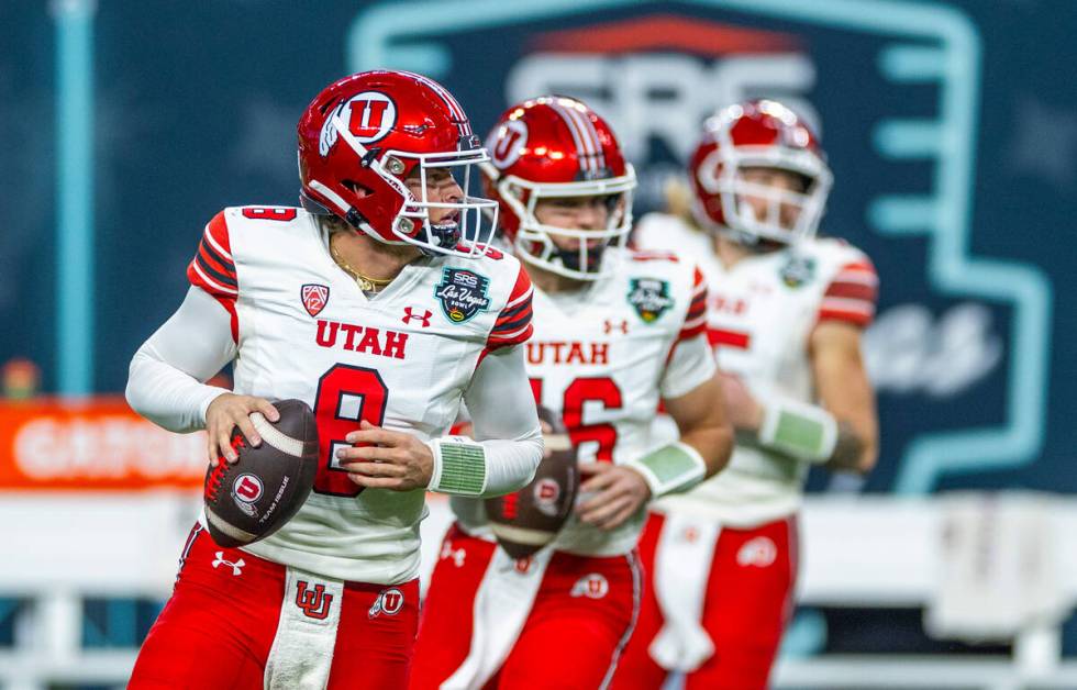 Utah Utes quarterbacks Brandon Rose (8), Bryson Barnes (16) and Luke Bottari (15) look for rece ...