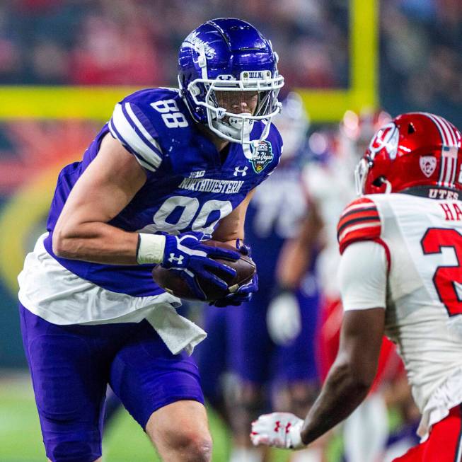 Northwestern Wildcats tight end Marshall Lang (88) makes a long reception near the end zone as ...