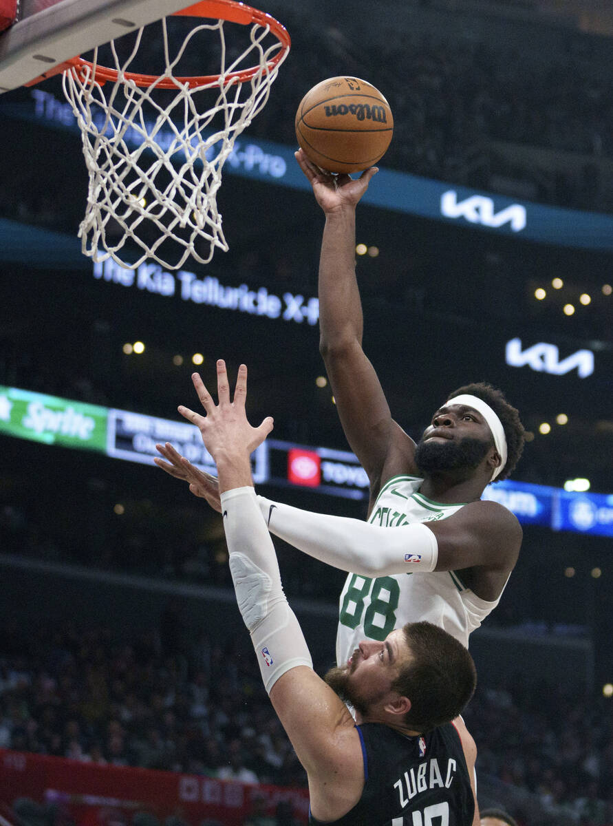 Boston Celtics center Neemias Queta (88) shoots over Los Angeles Clippers center Ivica Zubac (4 ...