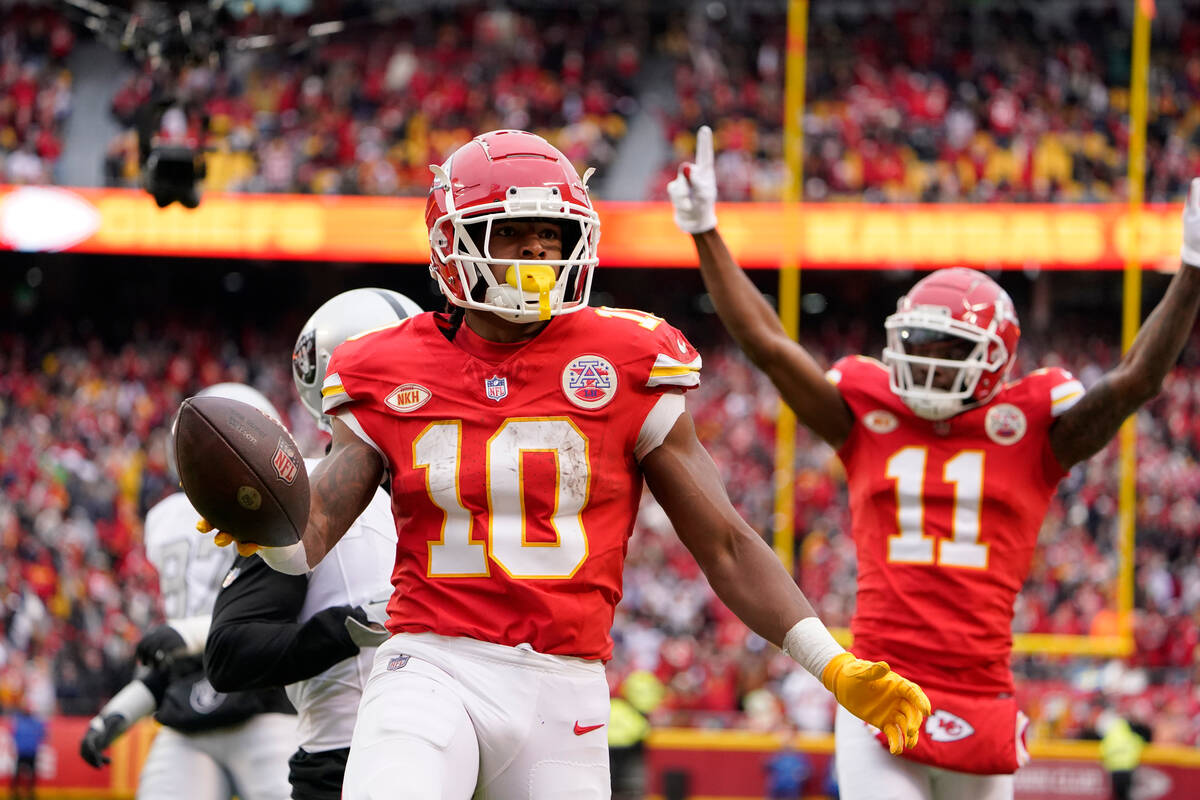 Kansas City Chiefs running back Isiah Pacheco (10) celebrates after scoring during the first ha ...