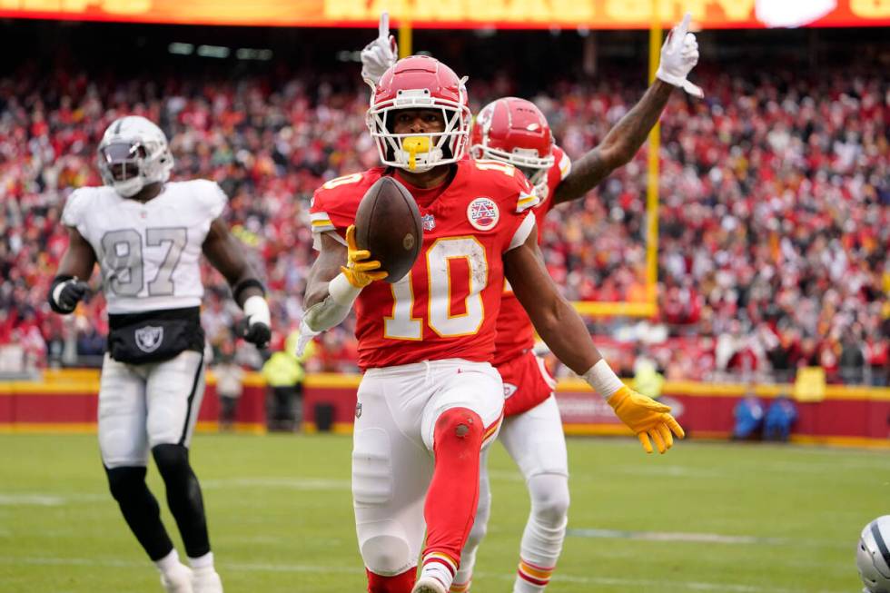 Kansas City Chiefs running back Isiah Pacheco (10) celebrates after scoring during the first ha ...