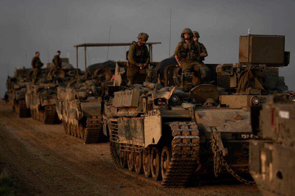 A convoy of Israeli army armoured personnel carriers (APC) is seen near the Israeli-Gaza border ...