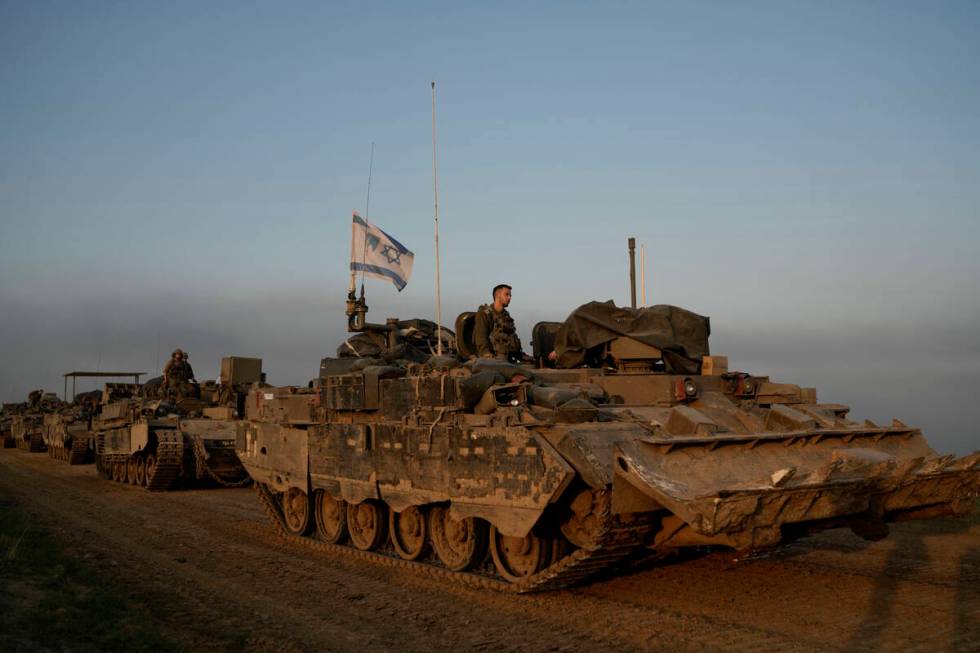 A convoy of Israeli army armoured personnel carriers (APC) is seen near the Israeli-Gaza border ...