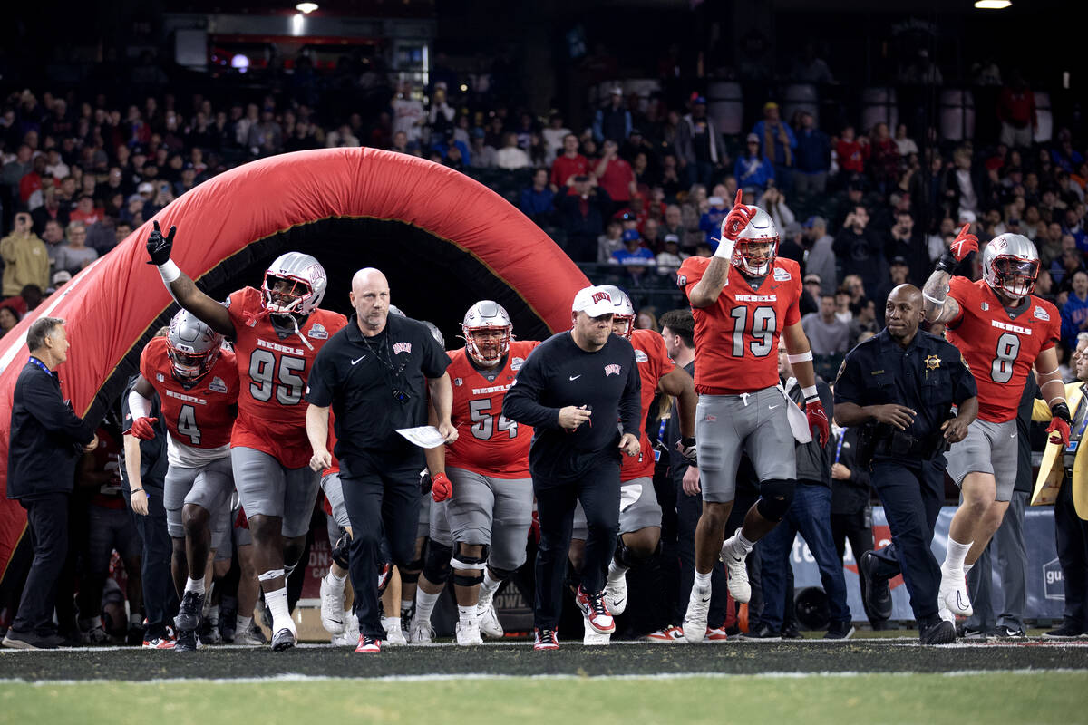 UNLV Rebels takes the field for the Guaranteed Rate Bowl NCAA college football game against the ...