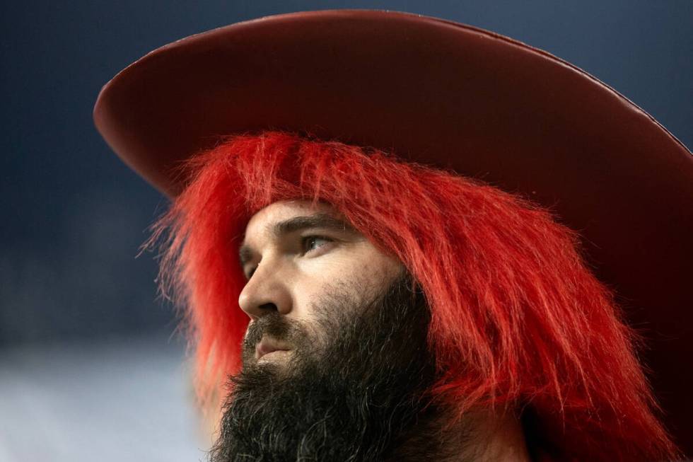 A UNLV Rebels fan looks out onto the field as his team is losing during the Guaranteed Rate Bow ...