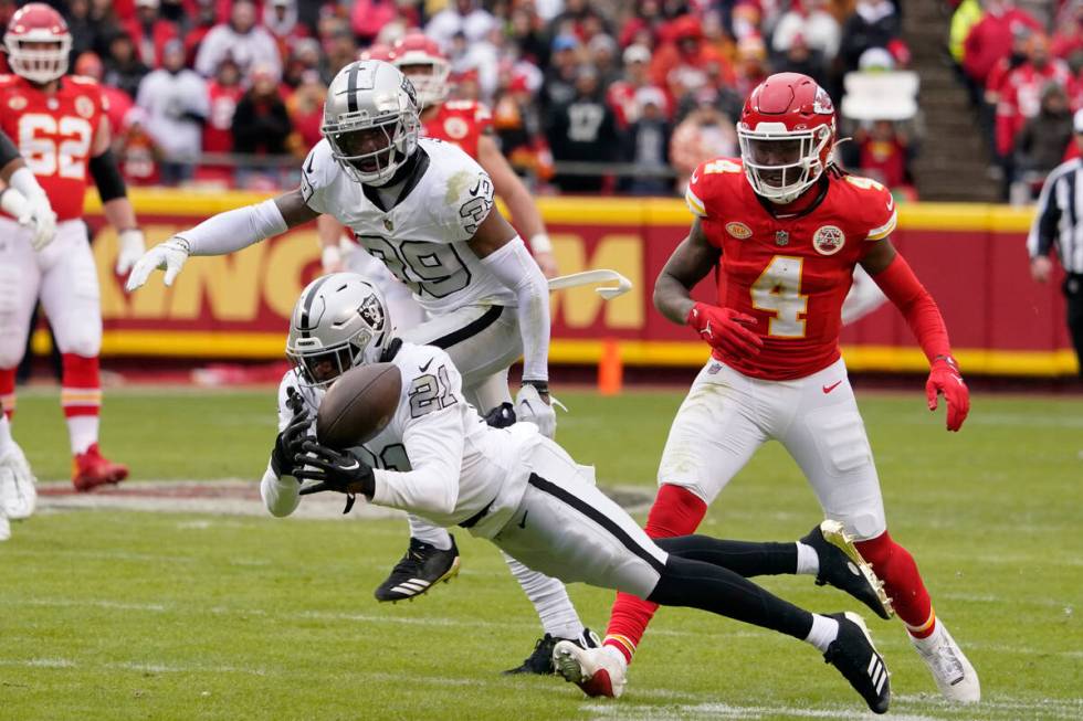 Las Vegas Raiders cornerback Amik Robertson (21) is unable to intercept a pass during the first ...