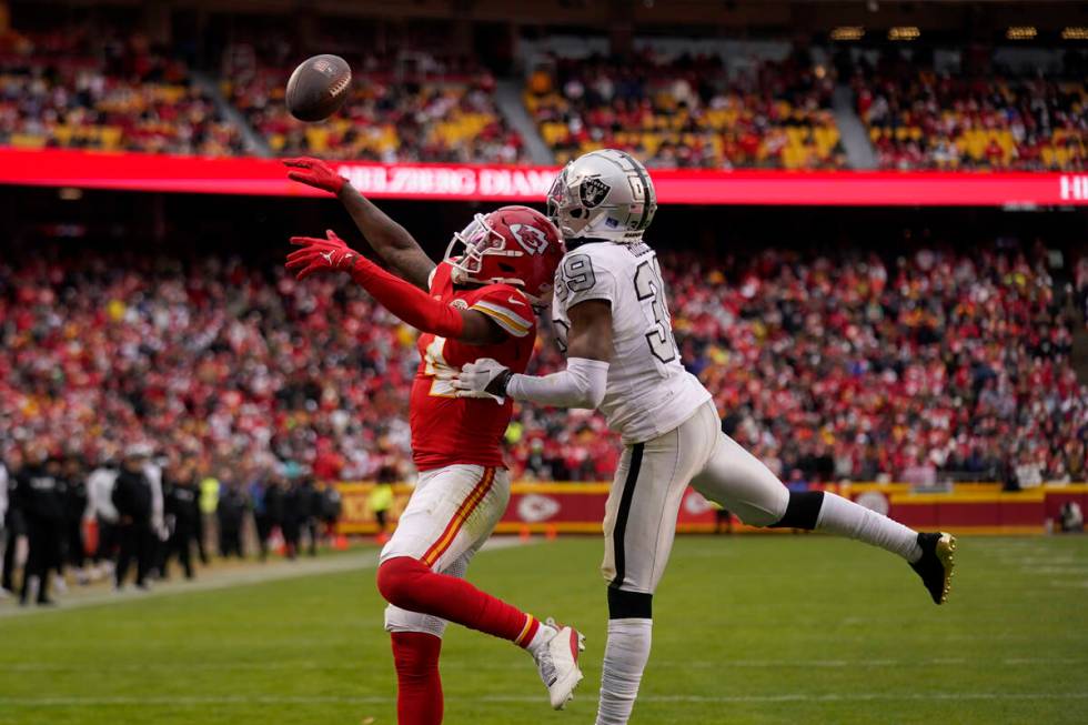 Las Vegas Raiders cornerback Nate Hobbs (39) breaks up a pass intended for Kansas City Chiefs w ...