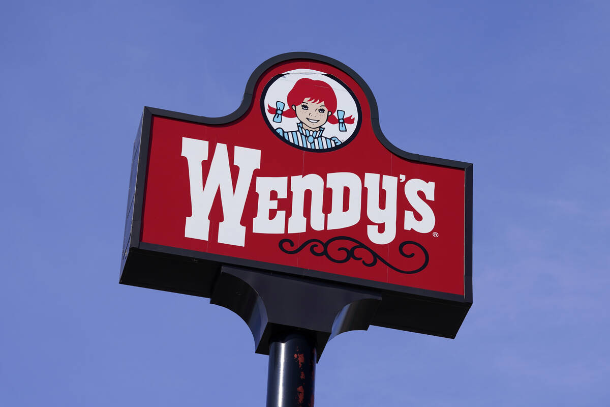 A sign stands over a Wendy's restaurant, Feb. 25, 2021, in Des Moines, Iowa. (AP Photo/Charlie ...