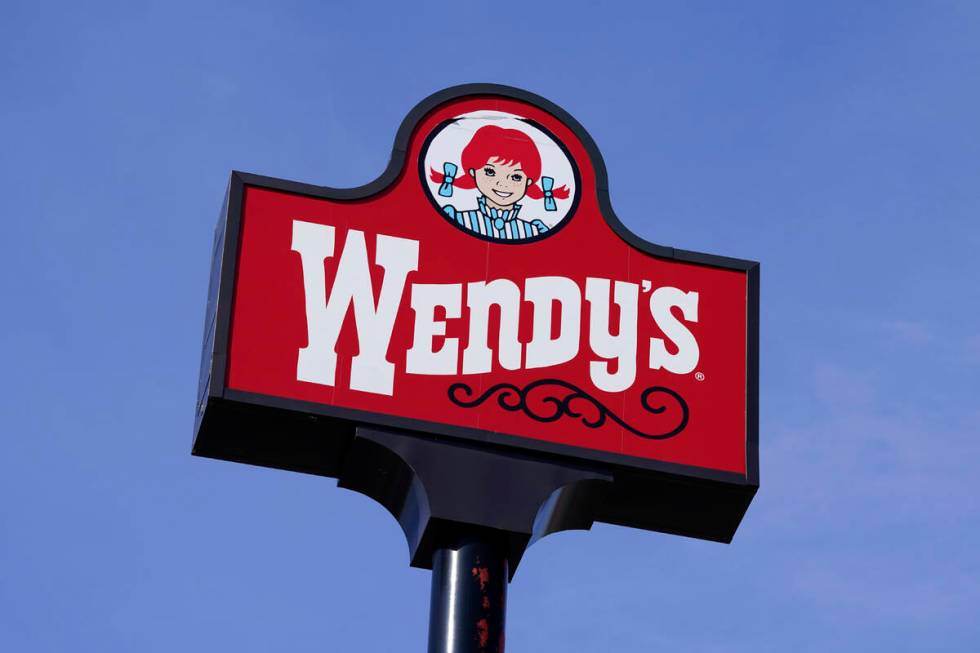 A sign stands over a Wendy's restaurant, Feb. 25, 2021, in Des Moines, Iowa. (AP Photo/Charlie ...