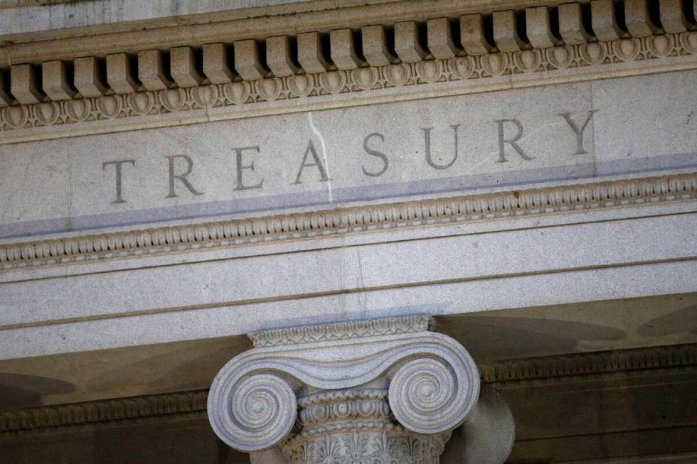 FILE- The U.S. Treasury Department building is shown at dusk in Washington on June 6, 2019. (AP ...