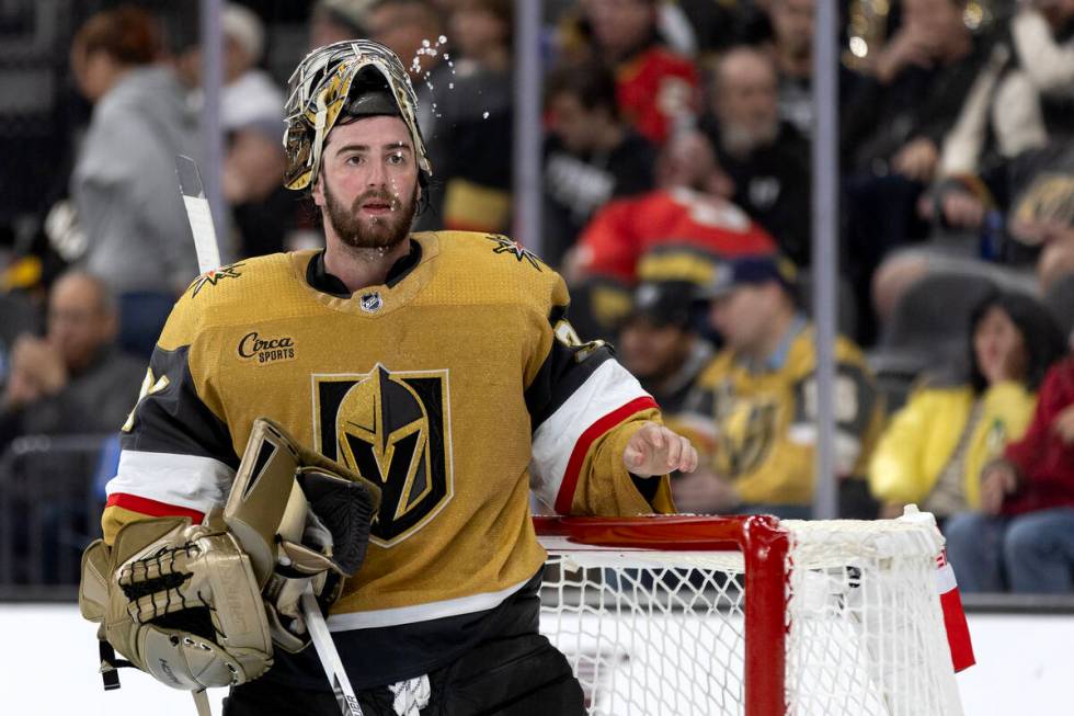 Golden Knights goaltender Logan Thompson (36) spits water during the second period of an NHL ho ...