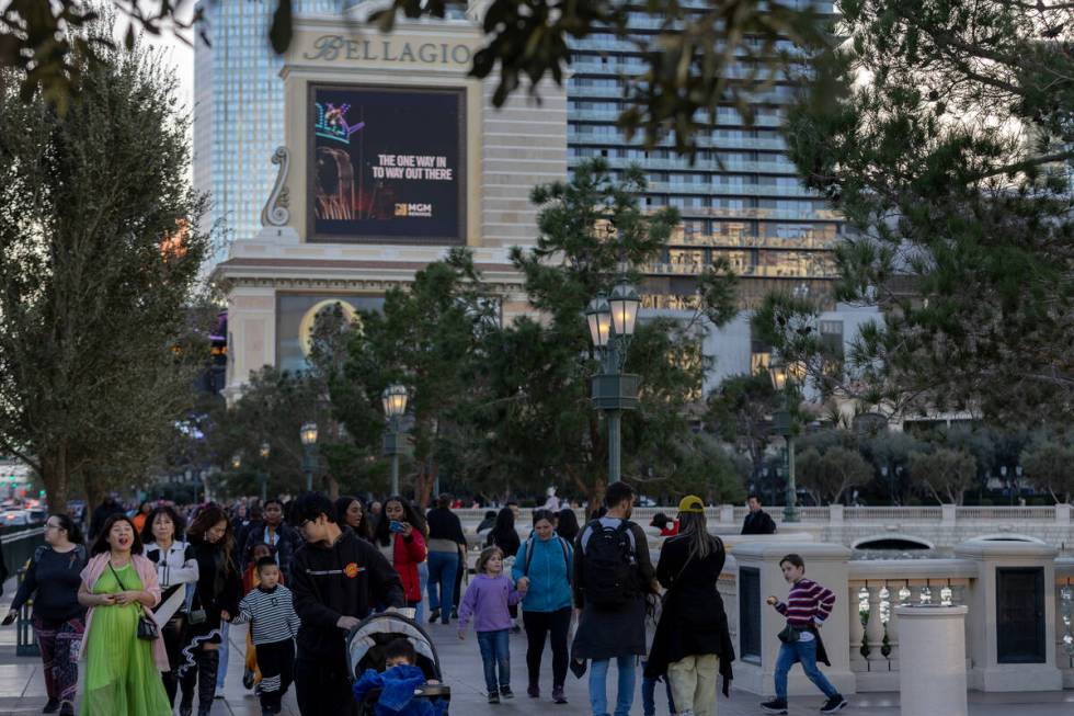 Pedestrians pass the Bellagio Fountains on Friday, Dec. 29, 2023, on the Las Vegas Strip. The i ...