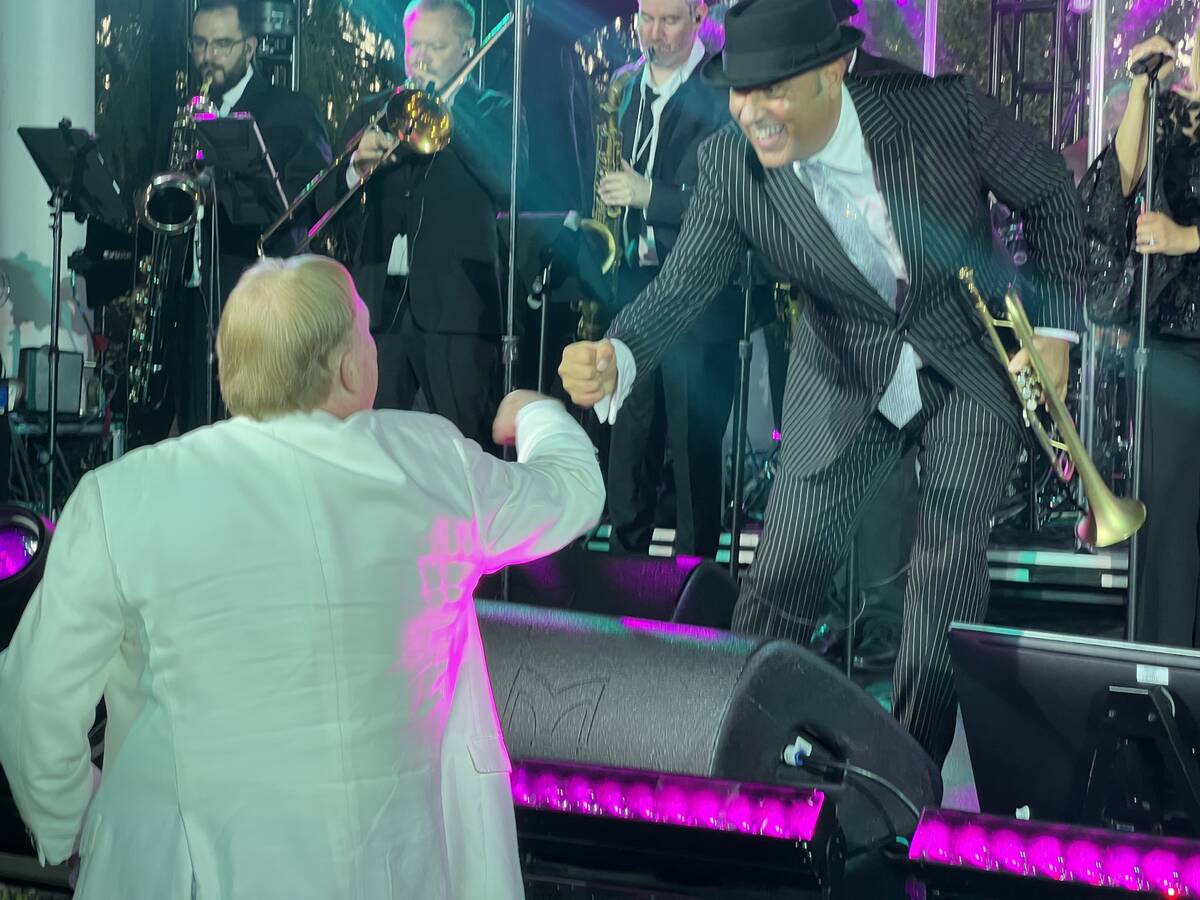 Raiders owner Mark Davis and David Perrico are shown at the Raiders' party honoring Cliff Branc ...