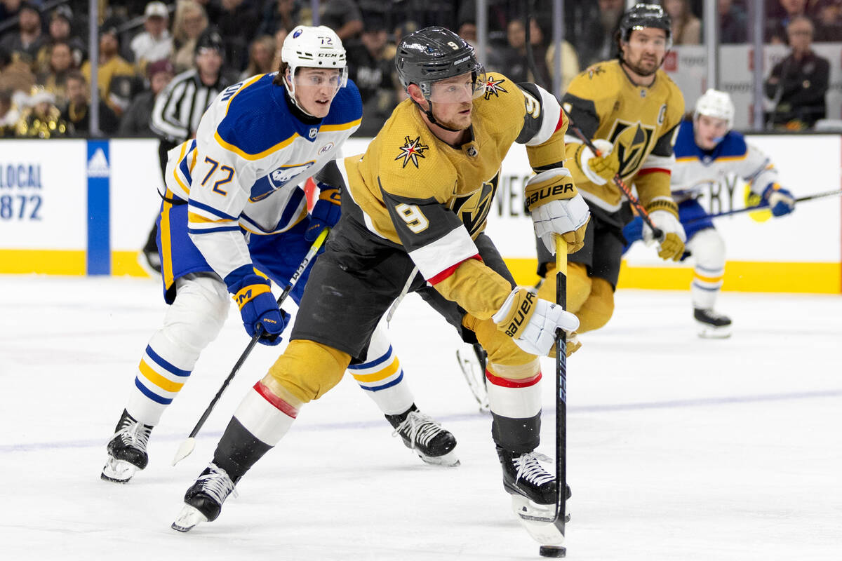 Golden Knights center Jack Eichel (9) drives toward the net against Sabres right wing Tage Thom ...
