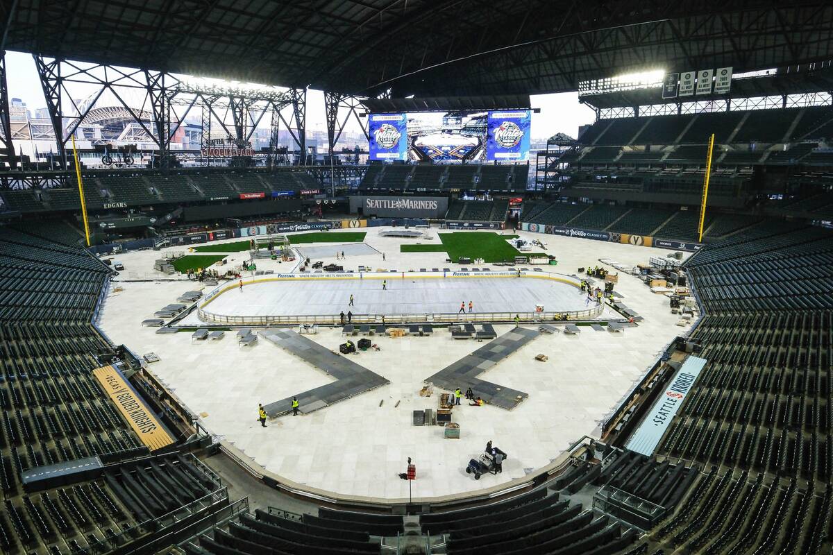 Construction continues on and around the rink for the New Year's Day NHL hockey Winter Classic ...