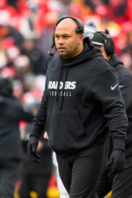 Las Vegas Raiders interim head coach Antonio Pierce watches his team in action against the Kans ...