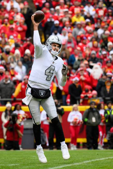 Las Vegas Raiders quarterback Aidan O'Connell passes during the first half of an NFL football g ...