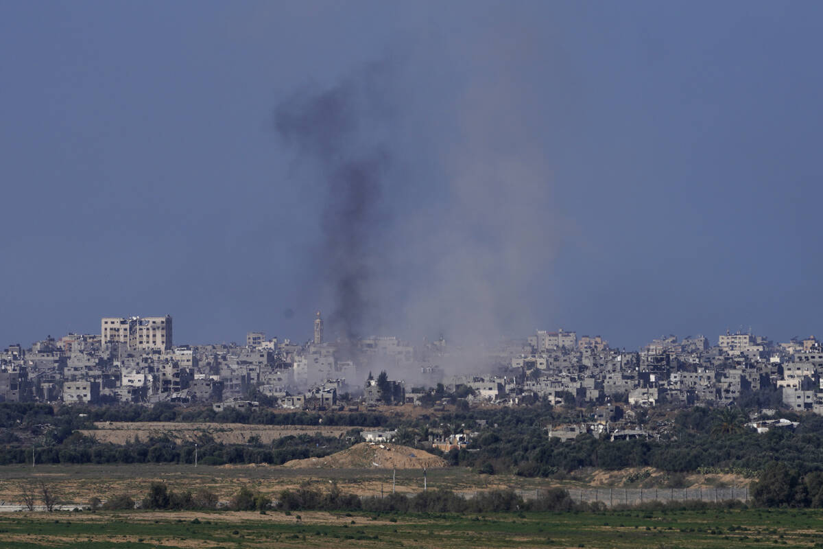 Smoke rises from the battlefield in the Gaza Strip, as seen from southern Israel, Saturday Dec. ...