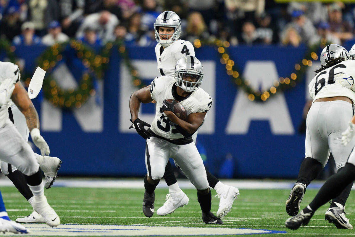 Las Vegas Raiders running back Zamir White (35) runs up the middle during an NFL football game ...