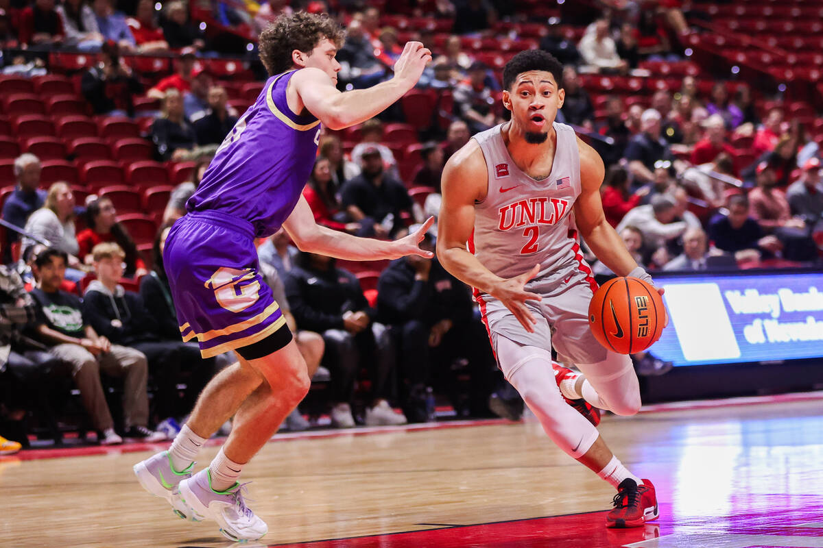 UNLV Rebels guard Justin Webster (2) dribbles the ball down the court past Carroll College Figh ...