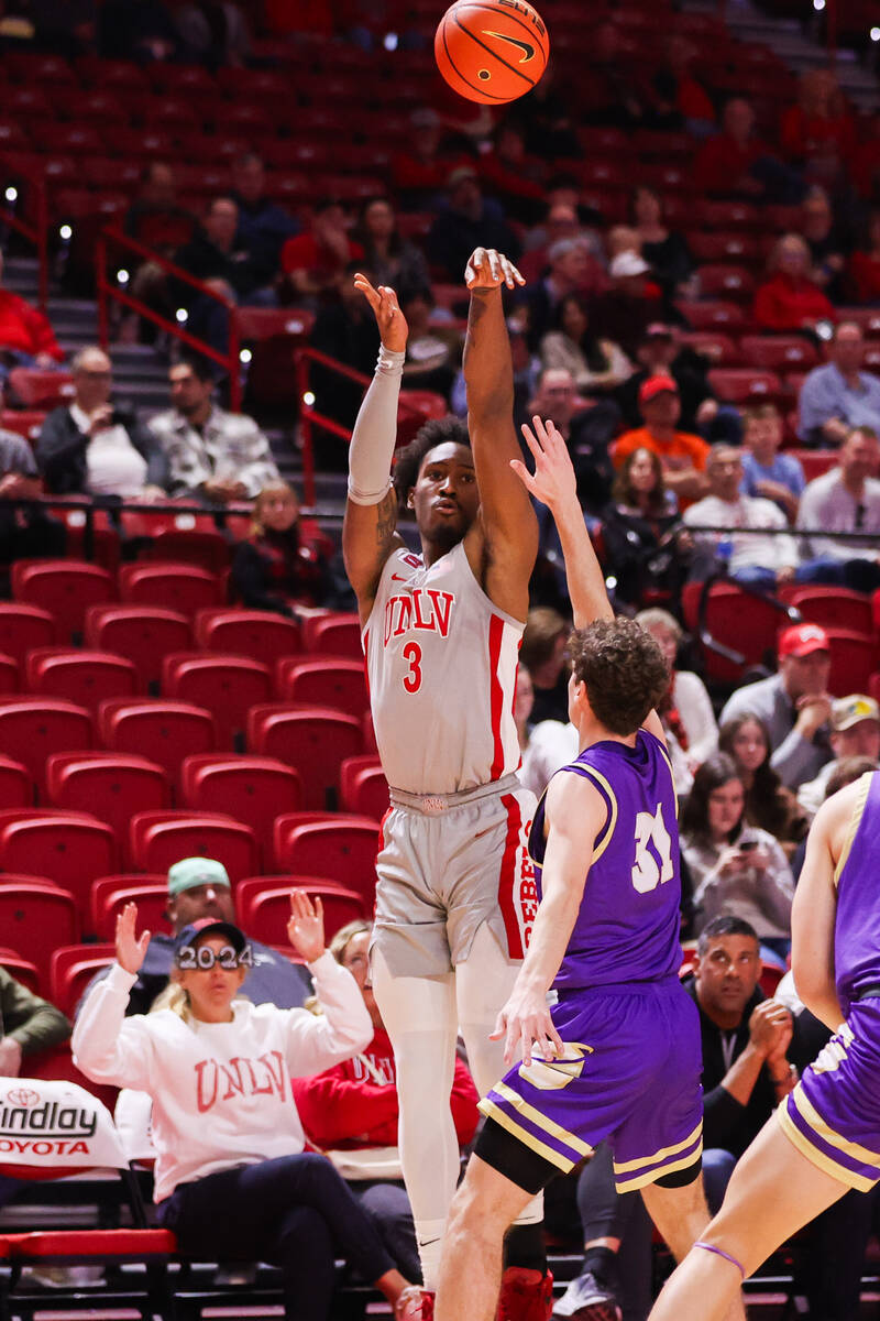 UNLV Rebels guard Shane Nowell (3) shoots a three pointer around Carroll College Fighting Saint ...