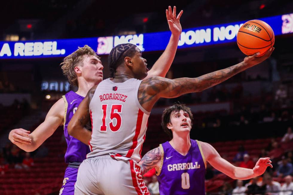 UNLV Rebels guard Luis Rodriguez (15) rebounds the ball during a college basketball game agains ...