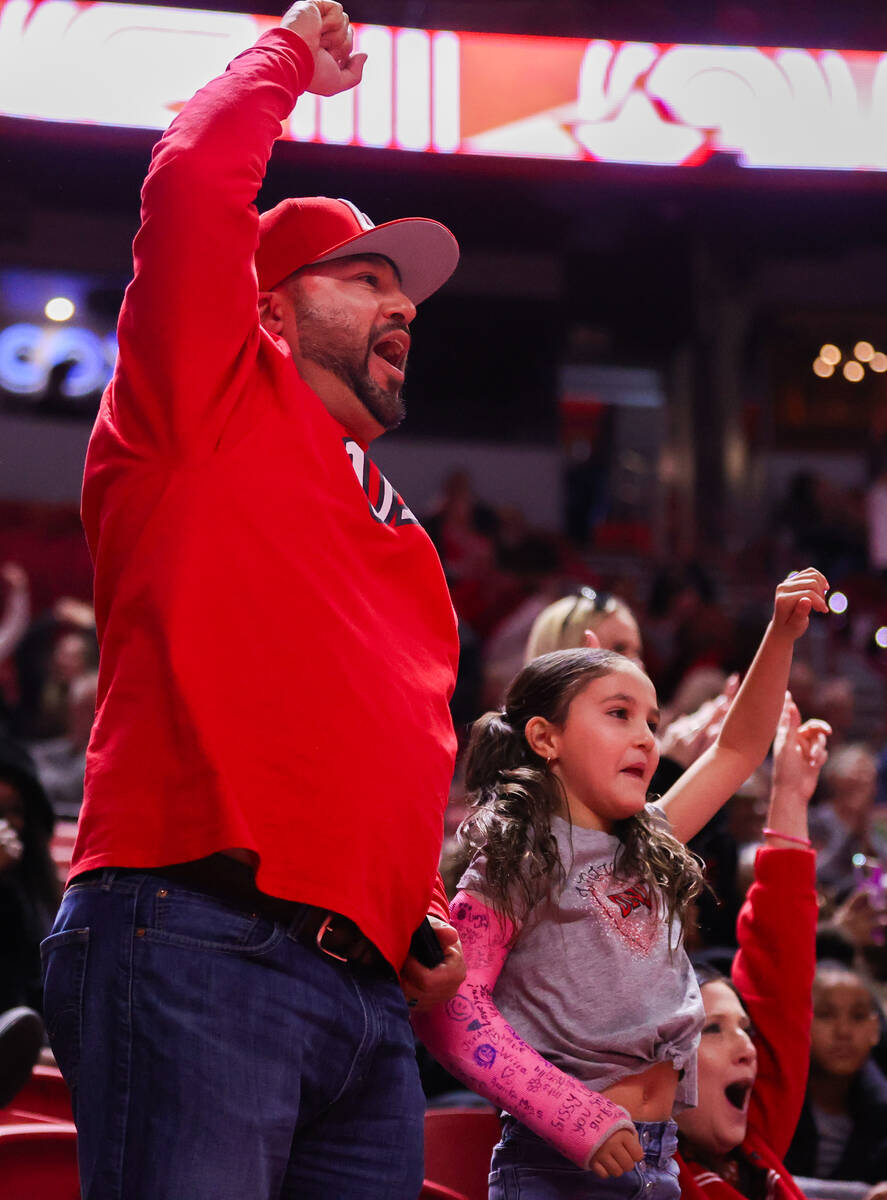 UNLV fans cheer on the Rebels during a college basketball game against Carroll College at Thoma ...